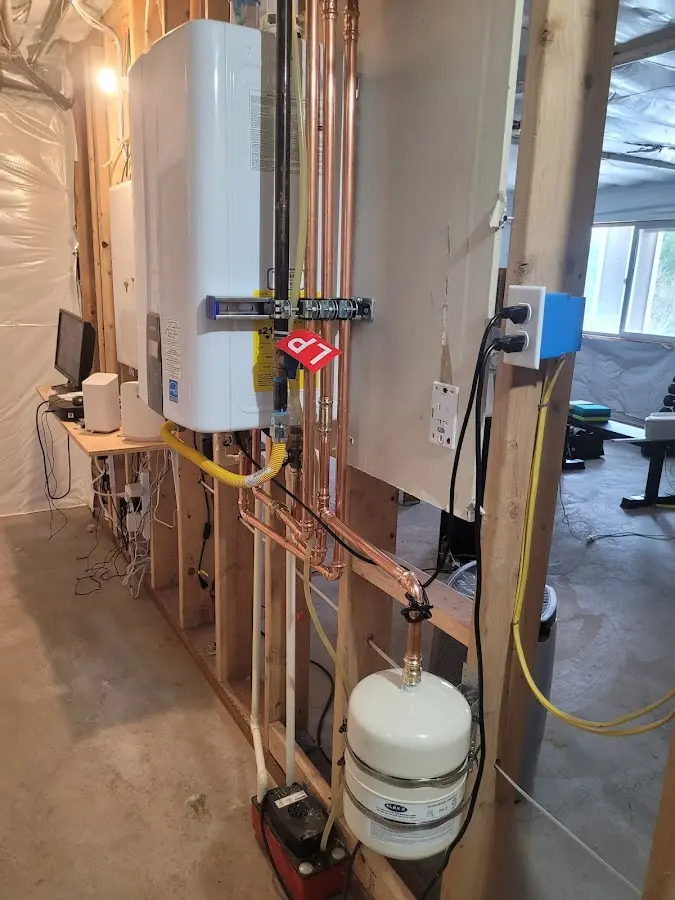 Licensed plumber repairing a kitchen sink in Mitchell
